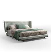 Gray upholstered bed with green and gray bedding on a white background