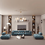 Load image into Gallery viewer, Modern living room with blue sofa set and decorative elements

