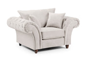 Beige armchair with tufted backrest on a white background