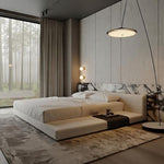 Load image into Gallery viewer, Modern bedroom with a large window, bed, and decorative elements.