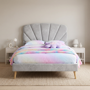 Merritt Upholstered Bed shown in light grey fabric in a bright bedroom – illustrative image – Dune & Pine