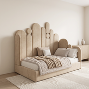 Aria Upholstered Bed shown in warm beige fabric in a bright bedroom – illustrative image – Dune & Pine
