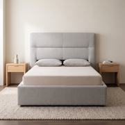 Crest Upholstered Bed shown in light grey fabric in a bright bedroom – illustrative image – Dune & Pine