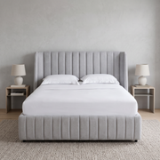 Vertical Channel Tufted Bed with Hydraulic Storage shown in light grey fabric in a bright bedroom – illustrative image – Dune & Pine