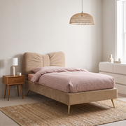 Kade Upholstered Bed shown in warm beige fabric in a bright bedroom – illustrative image – Dune & Pine
