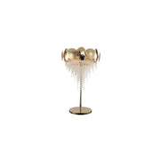 Decorative lamp with gold accents and crystal details on a white background