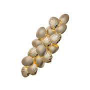 Decorative wall piece with spherical elements on a white background