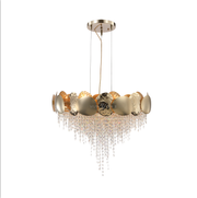 Gold pendant light with crystal accents on a white background