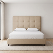 Luna Premium Bed Frame with buttoned grid headboard shown in beige fabric in a bright bedroom – illustrative image – Dune & Pine