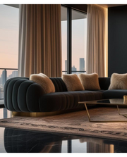 Modern living room with a stylish sofa and large windows overlooking a cityscape.