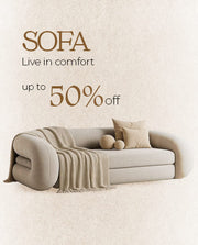 Promotional image of a sofa with a beige blanket and pillows on a light background, featuring text about a 50% discount.
