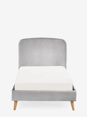 Gray upholstered chair with a white cushion on a white background