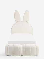 White rabbit-shaped ottoman on a white background