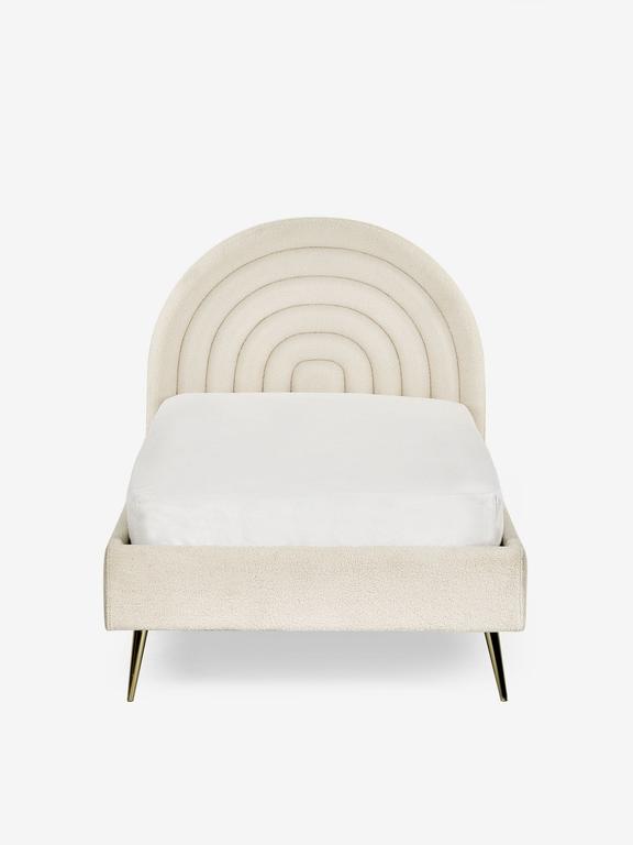 Beige bed with circular headboard on a white background