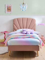 Children's bedroom with a pink bed, colorful blanket, and stuffed animal.